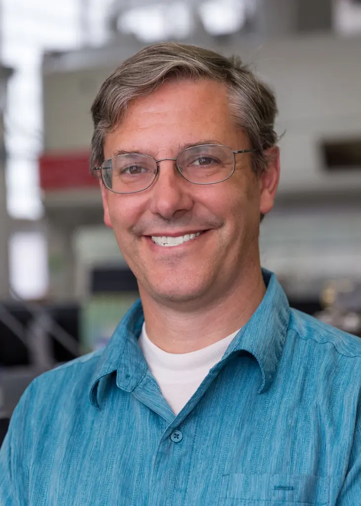 white man with short gray hair and glasses