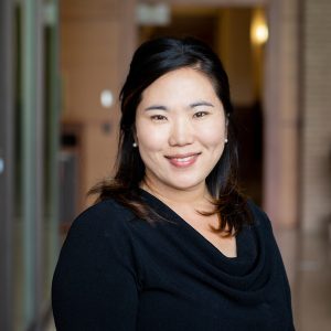 headshot of an asian woman with medium black hair