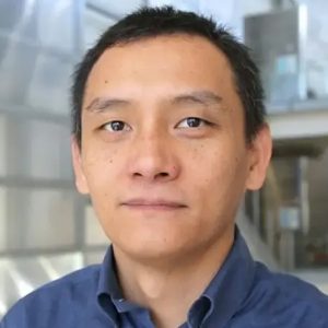 headshot of an asian man with short black hair