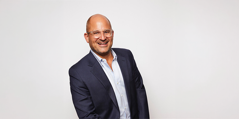 white man with a buzz cut and glasses