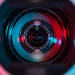 Picture of camera with bright colorful lighting around it